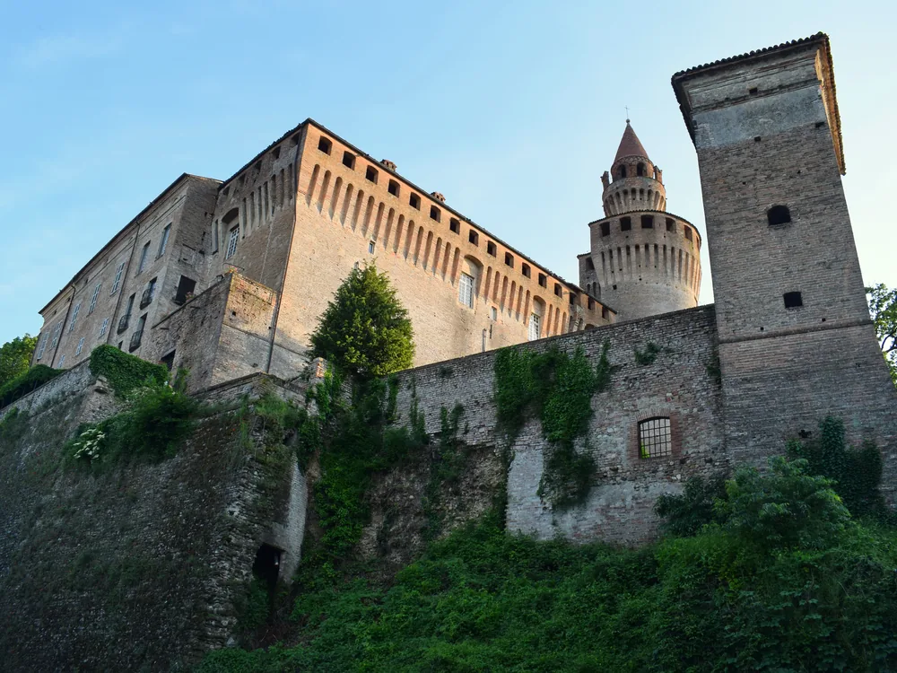 Rivalta Castle above the Trebbia valley near Piacenza, Italy — a medieval castle remodelled into a noble residence with a 15th-century terracotta courtyard