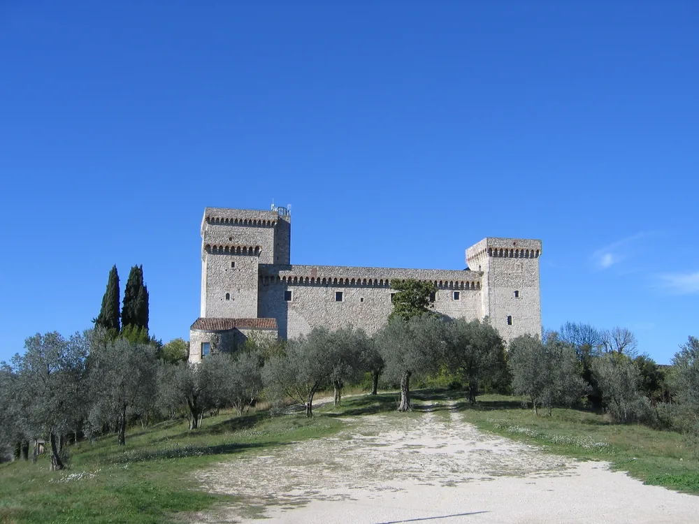 The Rocca Albornoziana di Narni on its hilltop above the Nera Valley gorge in Umbria, showing the cylindrical corner towers and medieval enclosure