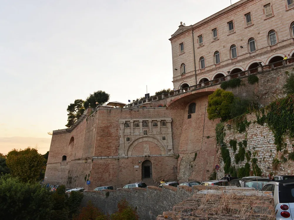 Rocca Paolina — the buried underground medieval streets and escalators of the papal fortress built over the Baglioni quarter after Perugia's 1540 Salt War defeat, Perugia, Umbria, Italy