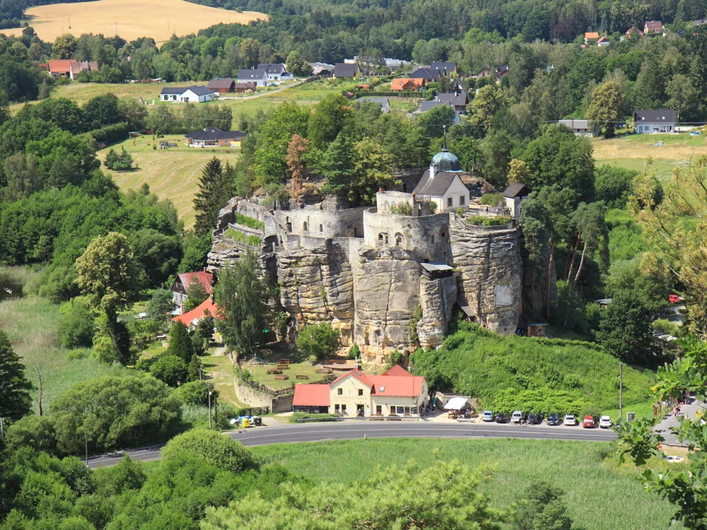 Rock Castle Sloup (Skalní hrad Sloup) in Northern Bohemia — the medieval castle carved directly into the Cretaceous sandstone rock formation at the centre of Sloup v Čechách, Czech Republic