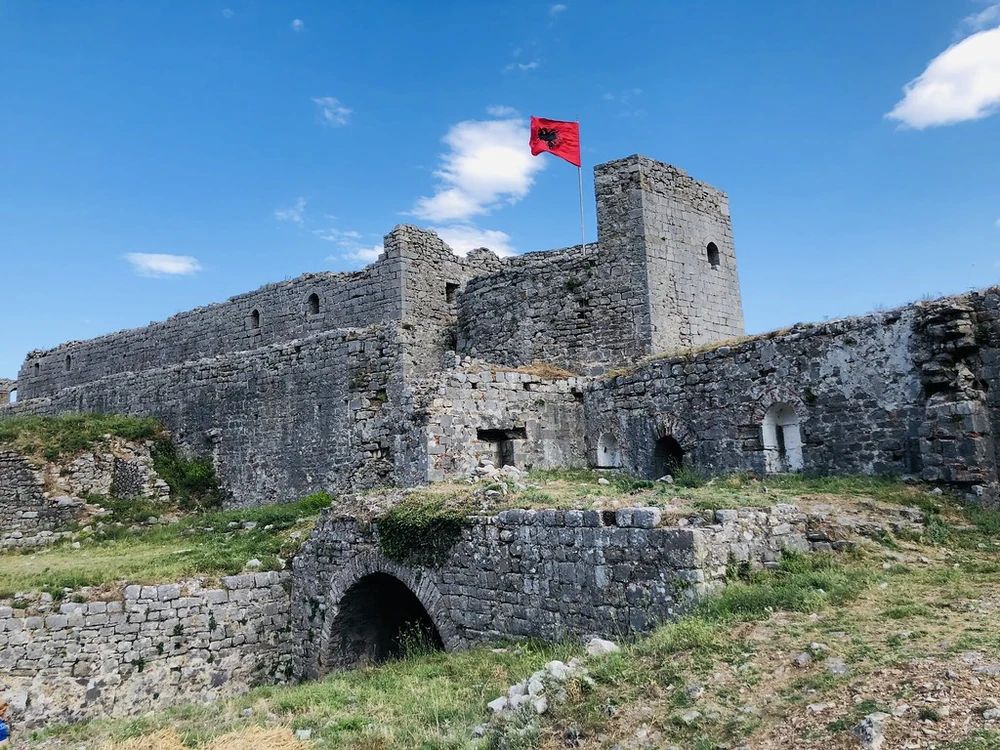 Rozafa Castle's Venetian walls on the rocky hill above Shkodër, Albania, with the confluence of the Buna, Drin and Kiri rivers visible below