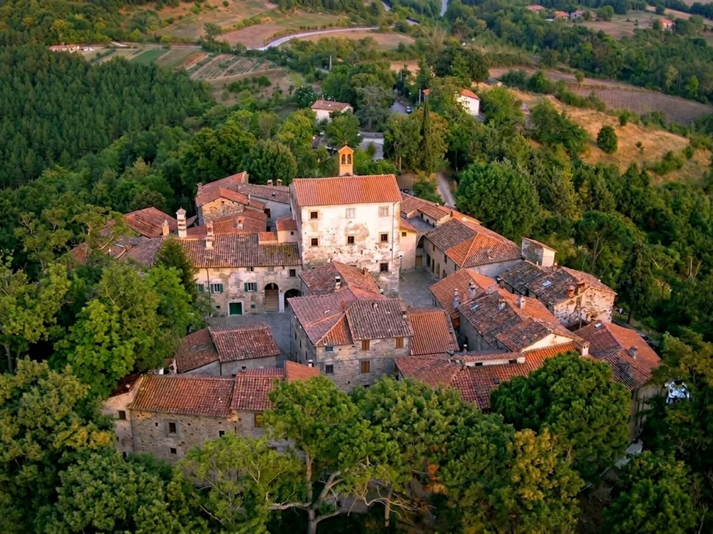 Sarna Castle, a fortified medieval complex with apartment-only accommodation, in the Casentino, Tuscany, Italy