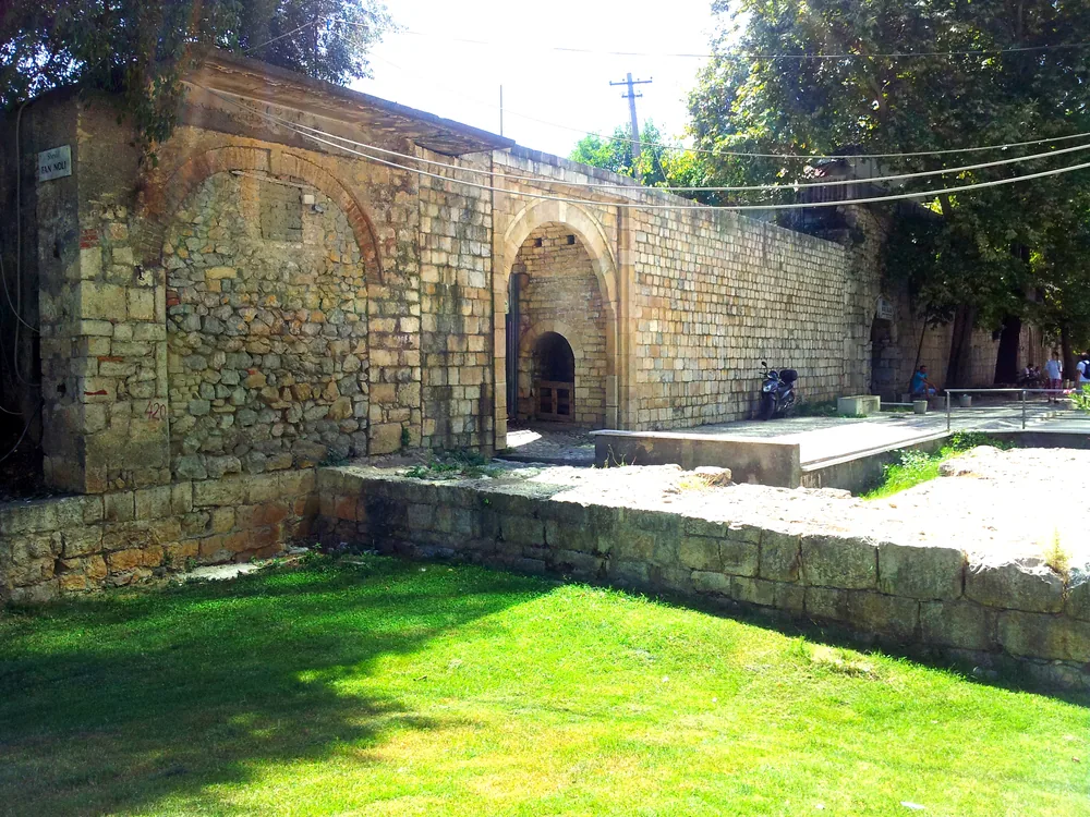 Toptani Castle remains and Clock Tower (Kulla e Sahatit) in Skanderbeg Square, Tirana, Albania — the Ottoman-era castle of the Toptani bey dynasty at the centre of the Albanian capital