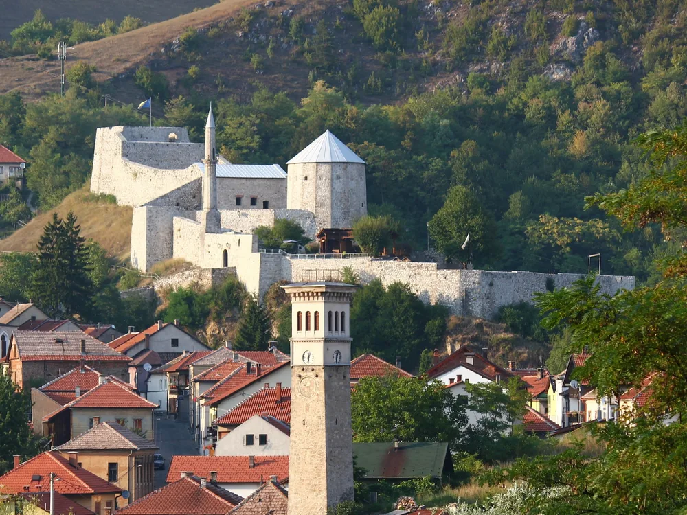 Travnik Fortress on the ridge above the Ottoman-era old town of Travnik, Bosnia — the 15th-century Ottoman fortification that overlooked the seat of the Bosnian Viziers for over a century