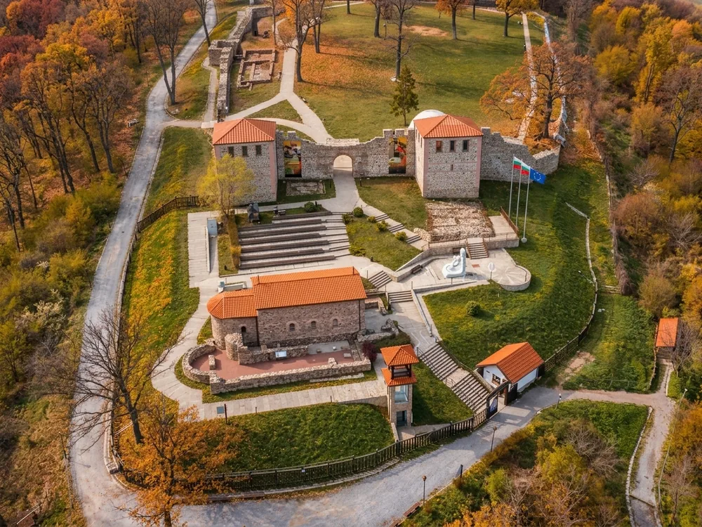 Tsari Mali Grad fortress in the Rila Mountain foothills near Belchin, Sofia Province, Bulgaria — the partially restored Roman-era fortress with five archaeological occupation phases, rediscovered in 2007