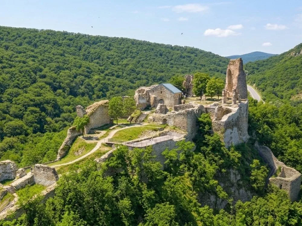 Ujarma Fortress on its plateau above the Iori River valley in Kakheti, Georgia — the 4th-century royal residence associated with Georgia's Christianisation, with panoramic views over the surrounding lowlands