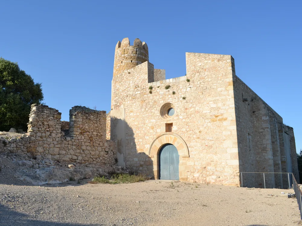 Ulldecona Castle on the limestone promontory above the Terres de l'Ebre — the 10th-century Moorish fortress near the Ebro Delta with panoramic views over the Montsià plain