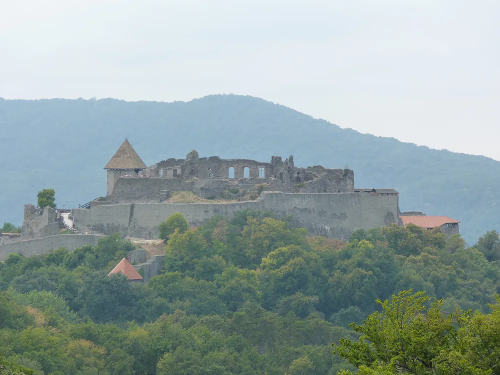 Visegrád Citadel (Fellegvár) on the ridge above the Danube Bend in Hungary — the 13th-century hilltop fortress built by King Béla IV after the Mongol invasion, with panoramic views over the Danube and the Börzsöny hills