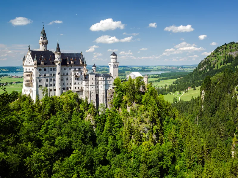 Neuschwanstein Castle seen from Marienbrücke in autumn gold