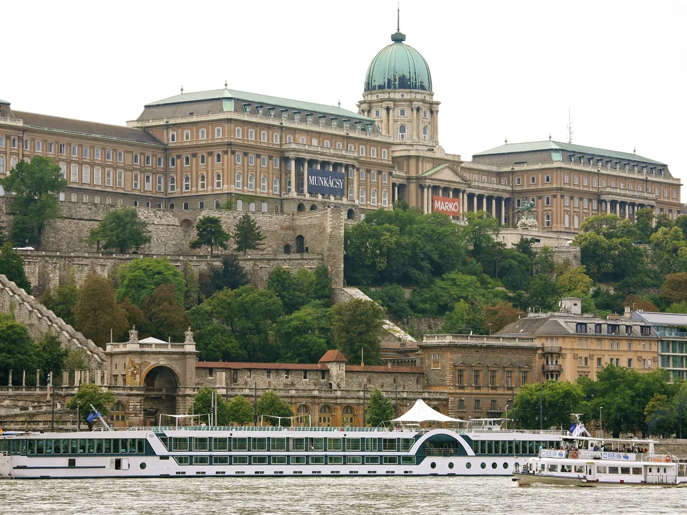 Buda Castle and the Fisherman's Bastion reflected in the Danube at sunset