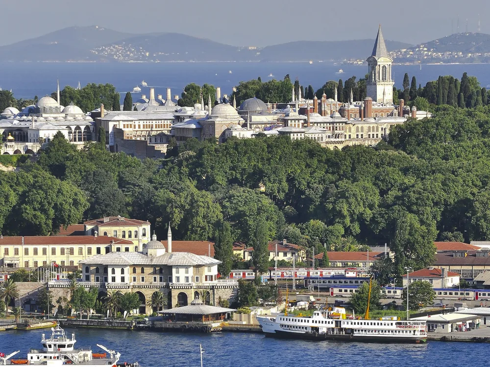 The Dolmabahçe Palace facade on the European Bosphorus shore — the 600-metre Neo-Baroque waterfront of the last Ottoman imperial palace, seen from the water