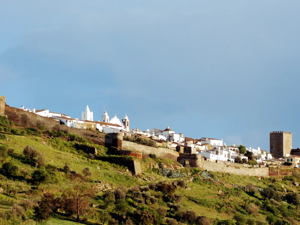 Monsaraz Castle on its hilltop above the Alentejo plain and Alqueva Lake, Portugal