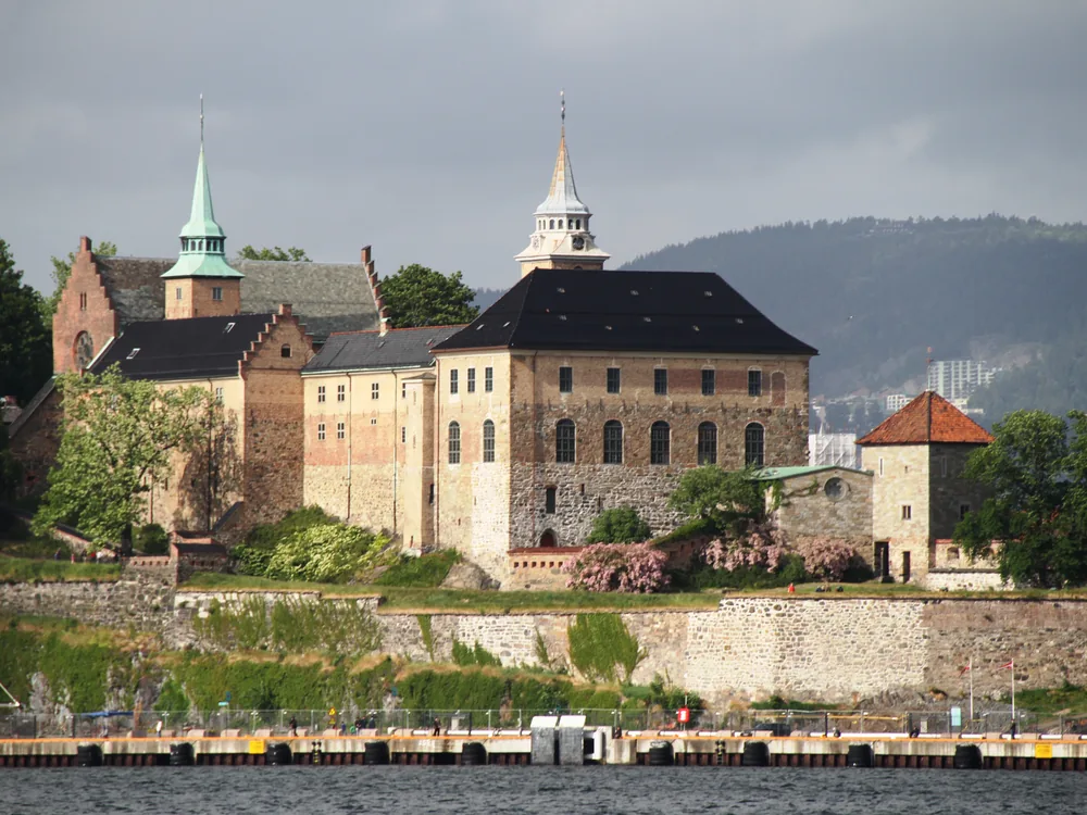 Akershus Fortress at dusk above the Oslo Fjord, Norway