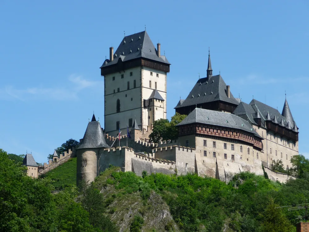 Karlštejn Castle perched on its forested ridge above the Berounka valley