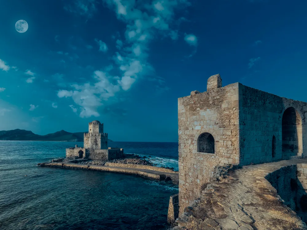 The Bourtzi octagonal tower at Methoni Castle — the Ottoman sea-tower on its own islet connected to the main Venetian fortress by a stone causeway across the Ionian Sea