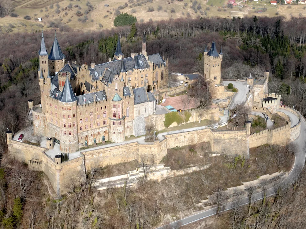 Hohenzollern Castle rising from its peak in the Swabian Alps, Germany