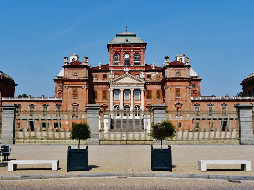 The Royal Palace of Racconigi above its landscaped English park — the Savoy court's preferred spring residence in the Po plain south of Turin